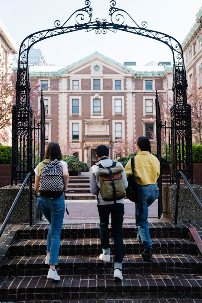 pexels-photo-7972506 Back View of People Walking into a Campus